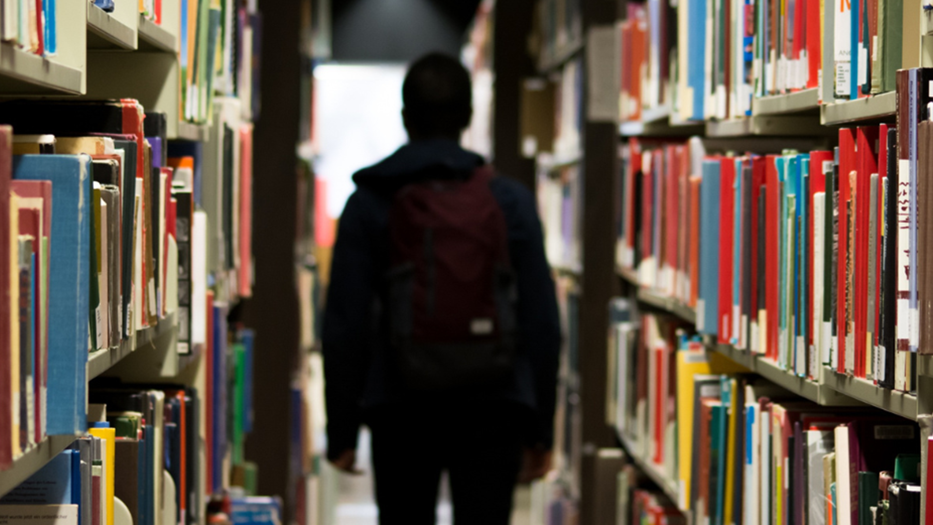 Student walking down a hallway